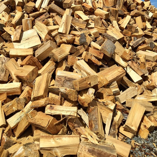 Photo of semi-seasoned pine firewood.